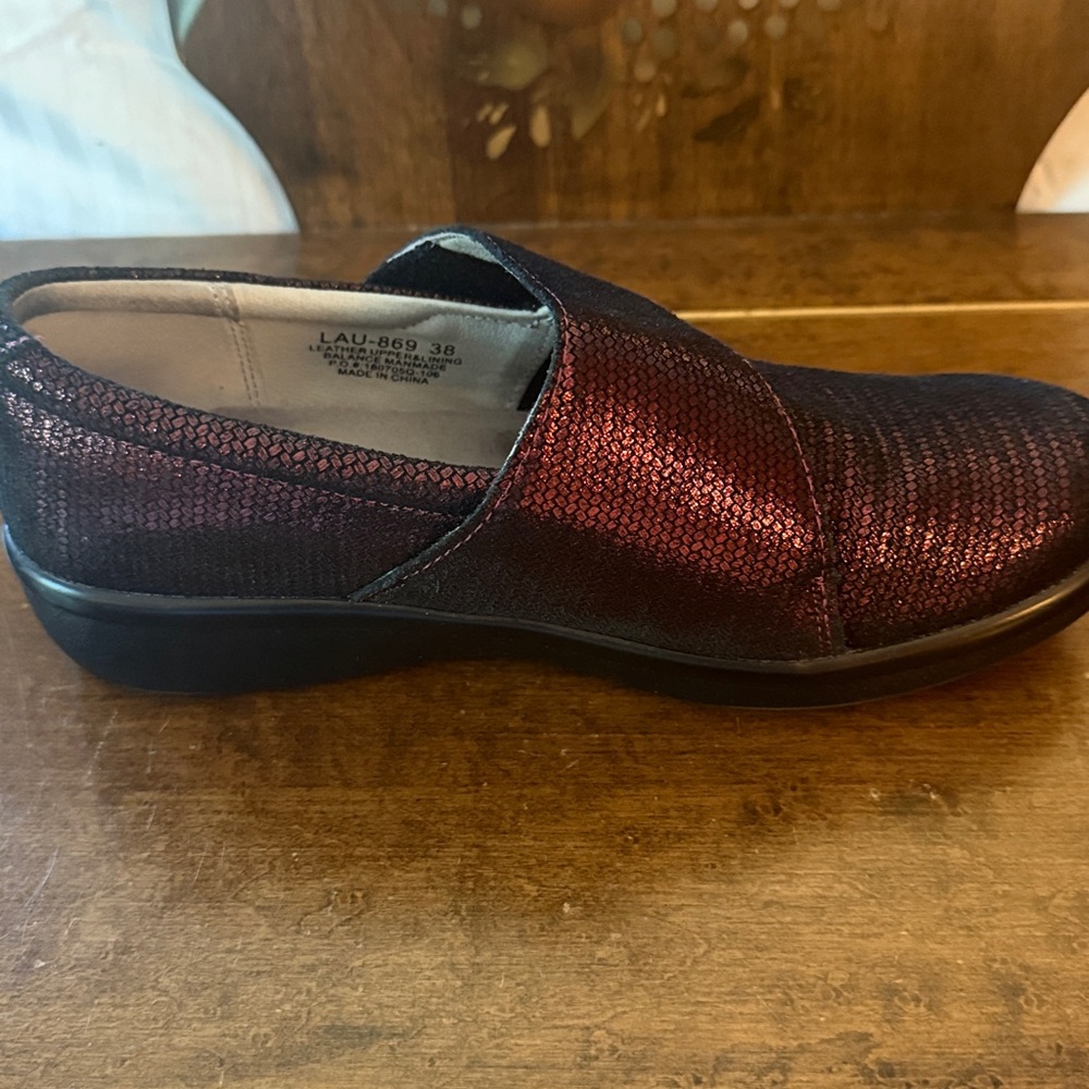 Alegria Sparkling Dark Red Slip-Ons. 1.25 inch rise.  Velcro function strap.